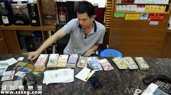 圖為<a href=http://www.32tj.com/shenzhen/ target=_blank class=infotextkey>深圳</a>(www.32tj.com)警方破獲重大地下錢莊案件中查獲的銀行卡及外幣